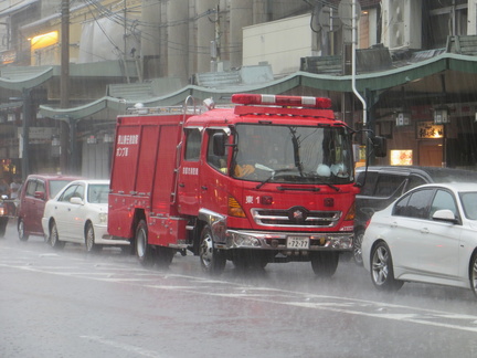 Kyoto firefighters under rain
