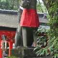 Old fox in apron at Fushimi Inari